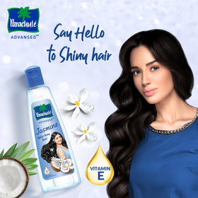 Parachute Advansed oil pouring to show lightweight texture and absorption benefit