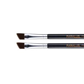 PARALLEL PRODUCTS brush in hand for scale showing comfortable grip and control benefit