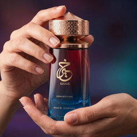 Paris Corner Khair Confection bottle in hand for scale showing 3.4 oz convenience