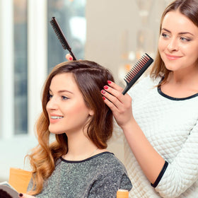 Patelai combs sectioning hair on a model demonstrating quick professional styling