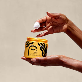 PATTERN applying cream to wet curly hair for defined, frizz-free styling
