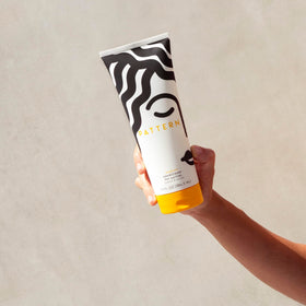 PATTERN conditioner applied to wet curls demonstrating detangling and manageability