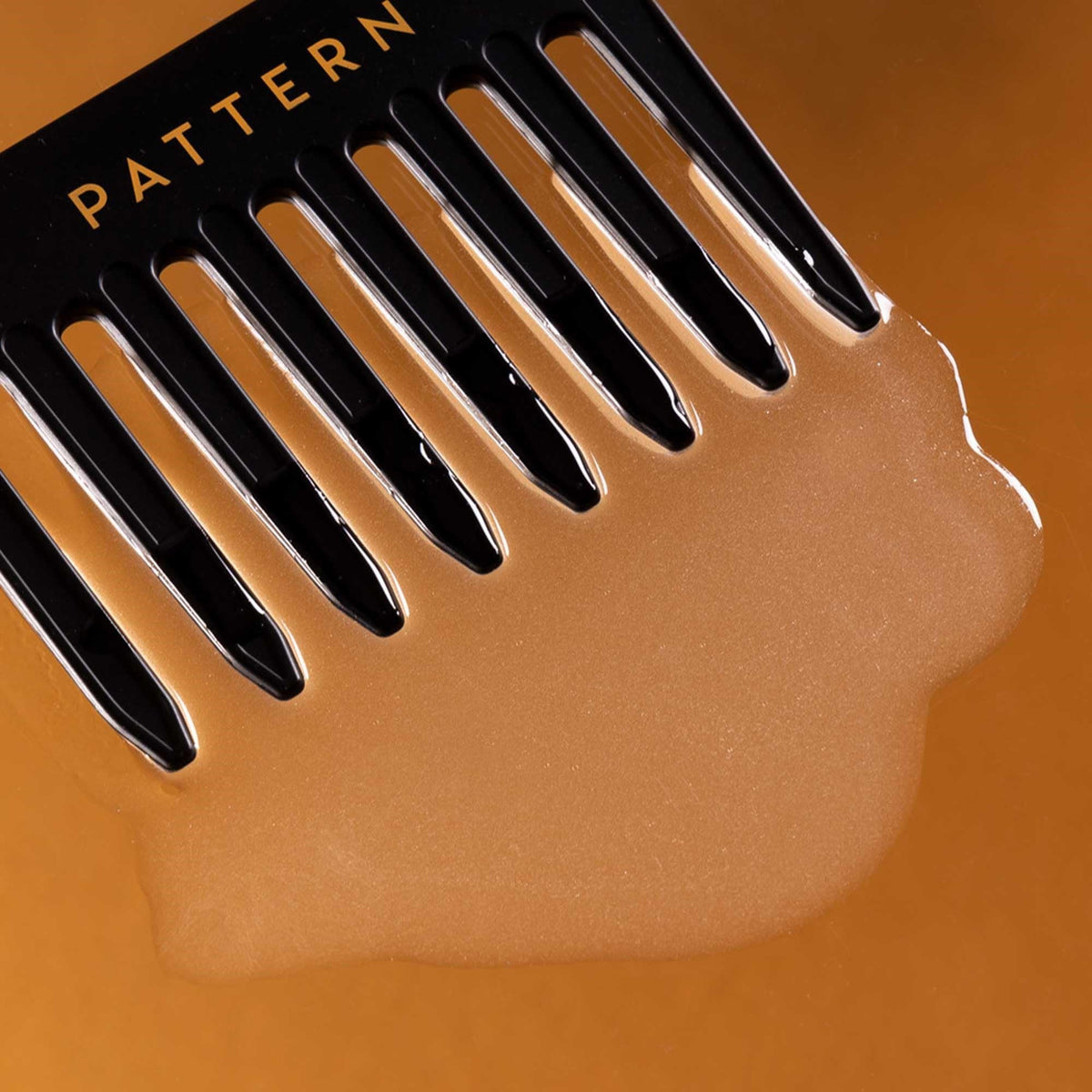 PATTERN texture on hand highlighting slippy nectar for smooth detangling