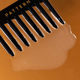 PATTERN texture on hand highlighting slippy nectar for smooth detangling