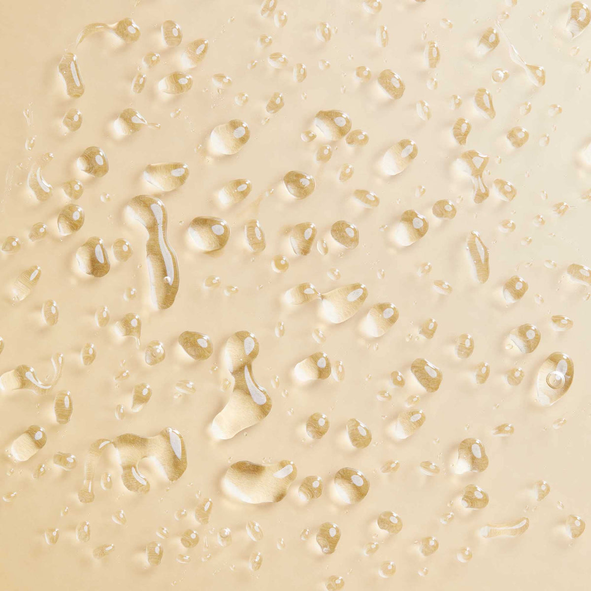 PATTERN milky-texture droplet on fingertip showing lightweight hydrating consistency