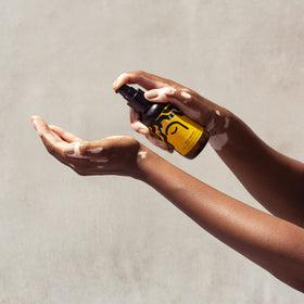 PATTERN applying serum to wet hair for sealed hydration and shine