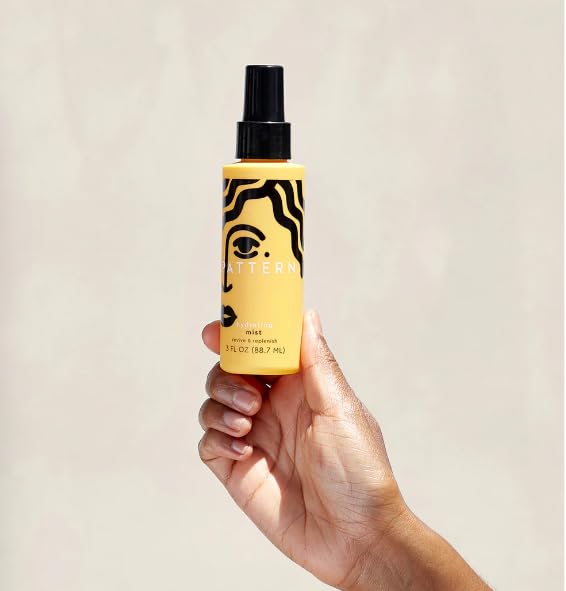 PATTERN lifestyle model with defined curls showing natural bounce and shine