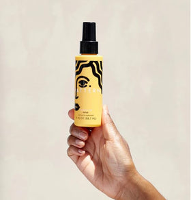 PATTERN lifestyle model with defined curls showing natural bounce and shine