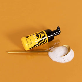 PATTERN mini curl mousse in hand to show travel size and portability benefit