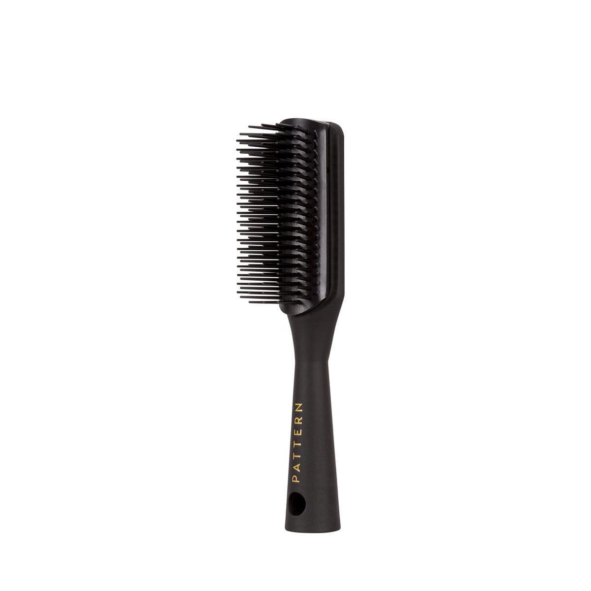 PATTERN brush bristle close-up displaying seven flexible rows that gently detangle and define