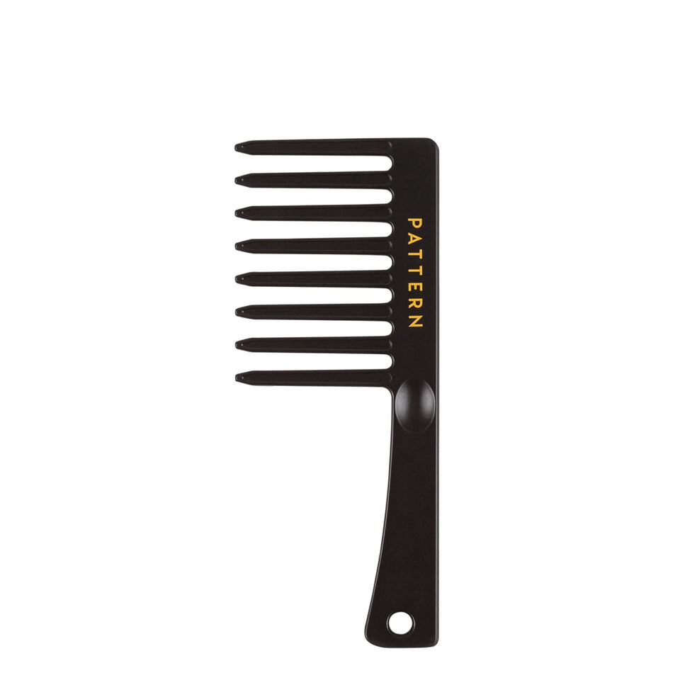 PATTERN mini wide tooth comb front view showing teeth and compact size, easy detangling