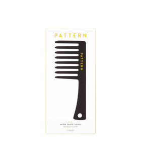 PATTERN comb being used to fluff curly hair for natural volume and separation
