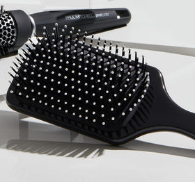 Close-up of Paul Mitchell 427 bristles and cushion showing smooth detangling benefit