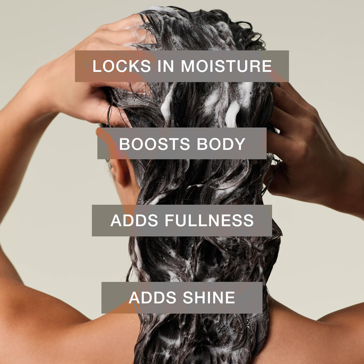Rich lather foam from Paul Mitchell shampoo demonstrating gentle cleansing action
