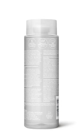 Paul Mitchell bottle on bathroom shelf in lifestyle scene, promoting daily use