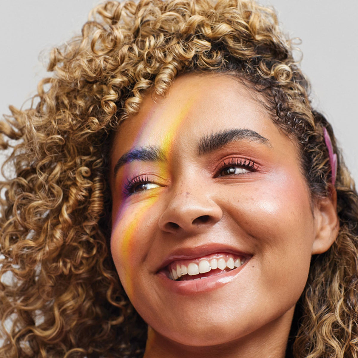 Paul Mitchell conditioner applied in hand onto wet hair for detangling benefit