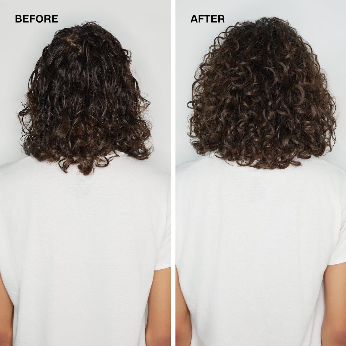 Paul Mitchell bottle in hand to show 6.8 fl oz size and travel practicality