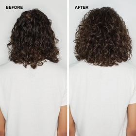 Paul Mitchell bottle in hand to show 6.8 fl oz size and travel practicality
