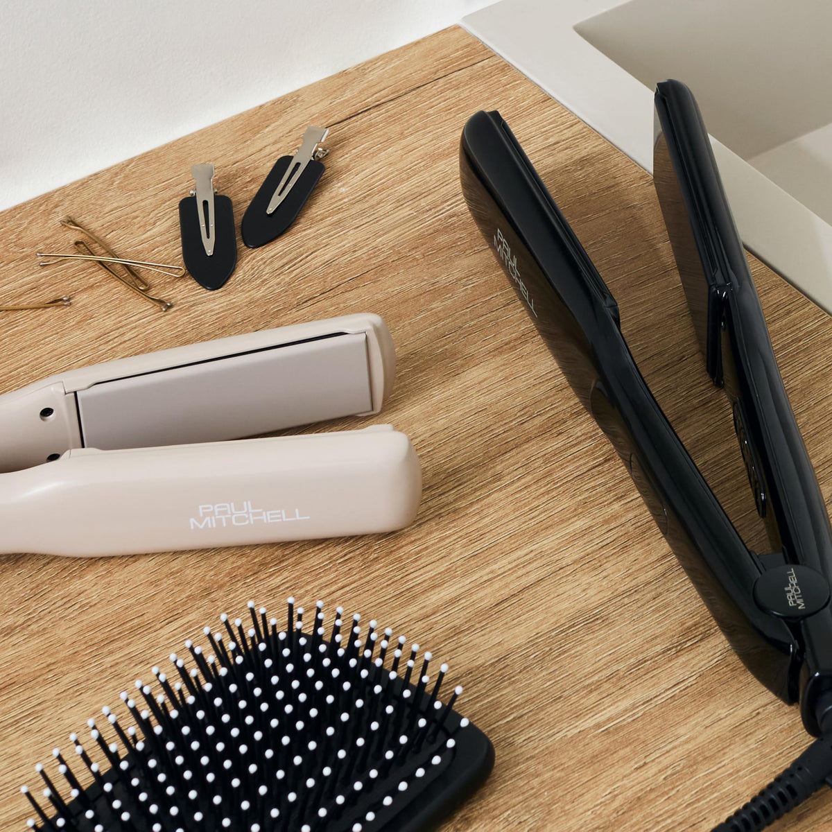 Paul Mitchell paddle brush with packaging highlighting salon-quality brand support