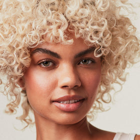 Label close-up on Paul Mitchell bottle highlighting ingredients and eco details