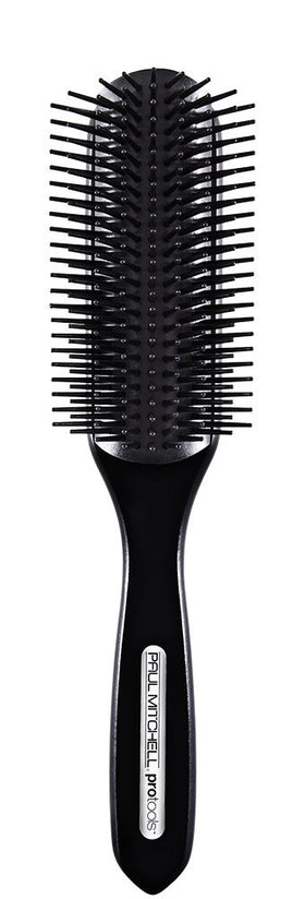 Paul Mitchell Pro Tools brush front view showing rounded head and handle for versatile styling