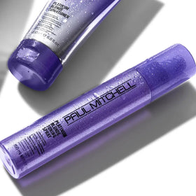 Paul Mitchell close-up of violet-tinted spray texture delivering concentrated toning pigments