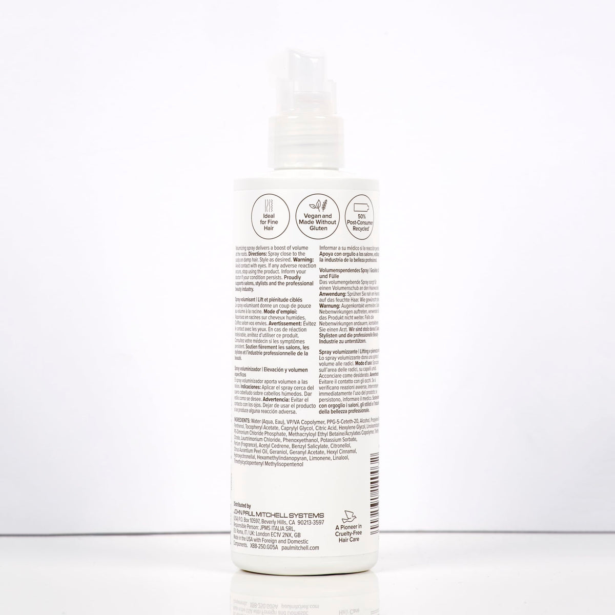 Paul Mitchell stylist applying root boost in salon for professional volumizing results