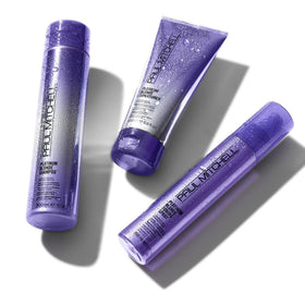 Paul Mitchell applying purple toning spray to blonde hair for instant neutralizing of warm tones
