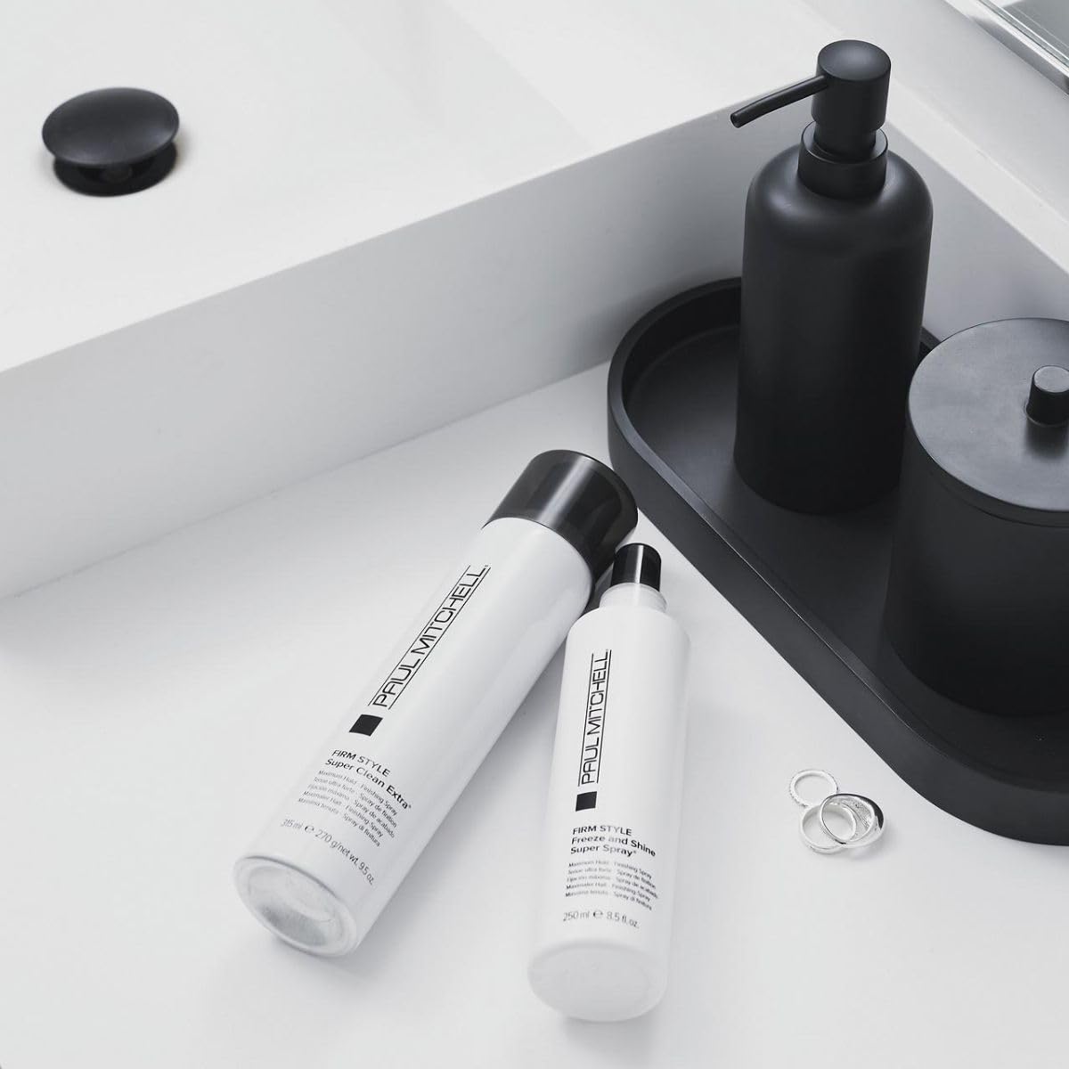 Paul Mitchell being sprayed on styled hair demonstrating long-lasting hold