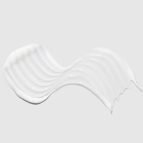 Paul Mitchell pump dispensing conditioner demonstrating convenient salon-style use