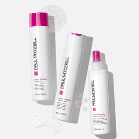 Paul Mitchell Super Strong Conditioner next to common items for scale, shows 10.14 fl oz size
