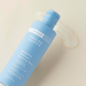 Paula's Choice cap and label detail, emphasizes fragrance-free and ingredient transparency
