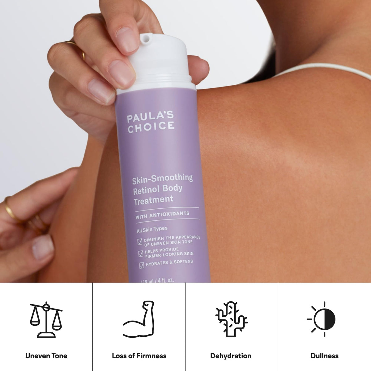 Paula's Choice bottle in hand for scale showing travel‑friendly 4 oz convenience