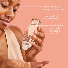 Peach & Lily applying essence to hand to show lightweight layering benefit