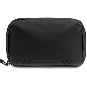 Peak Design front view showing compact black organizer and neat silhouette benefit