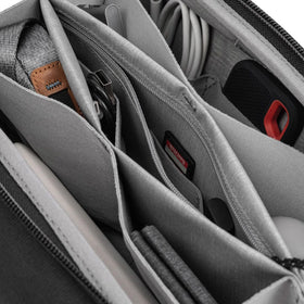 Peak Design next to smartphone to show scale and portable convenience