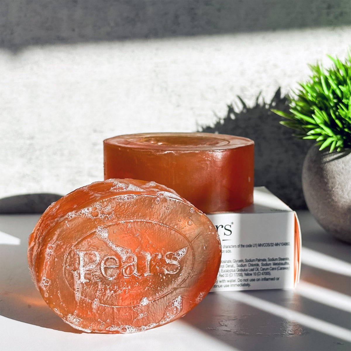 Pears bar in hand size scale showing convenient weight and everyday use