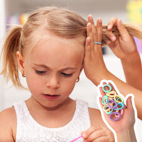 Pengxiaomei hair bands holding a child's ponytail showing gentle hold and comfort benefit
