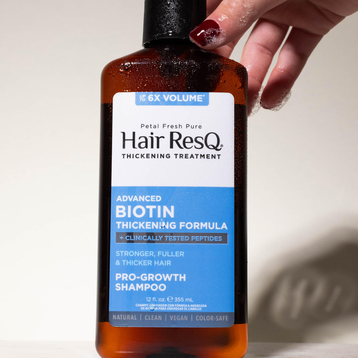 Petal Fresh bottle staged in bathroom creating lifestyle context for daily haircare routine