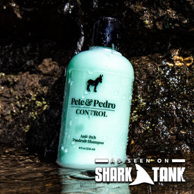Person applying Pete & Pedro shampoo in hands, demonstrates soothing and cooling scalp relief
