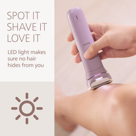 Philips shaver held in hand in shower illustrating wet use and slip‑resistant grip