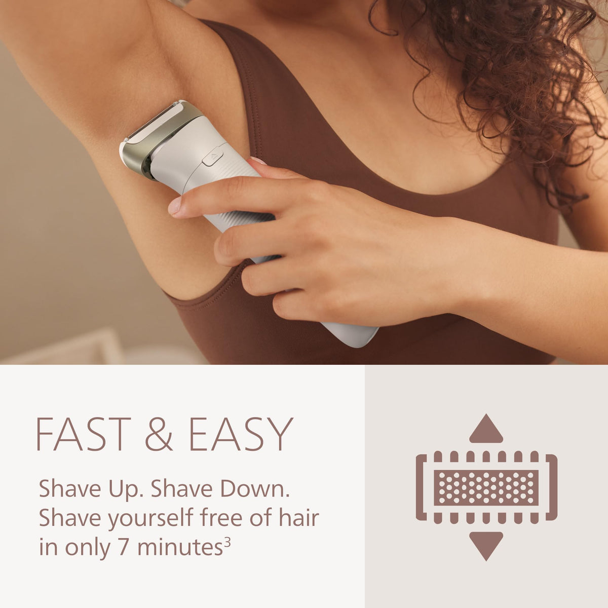 Philips shaver held in hand showing scale and travel-friendly size