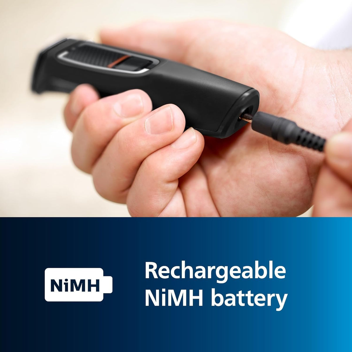 PHILIPS Multigroom MG3740 held in hand to show compact size and ergonomic grip