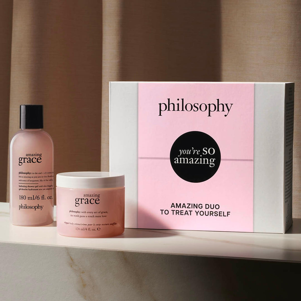 philosophy lifestyle shot in bathroom showing shower gel and crème for travel convenience