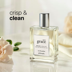 philosophy spray mist from grace bottle on wrist, demonstrating easy on-the-go use