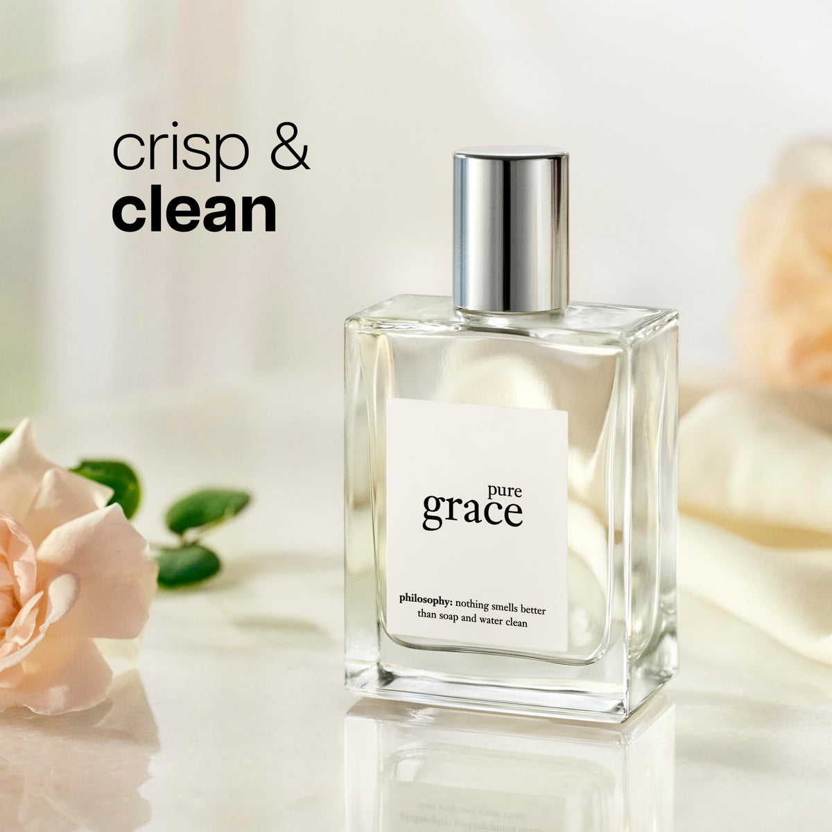 philosophy pure grace spray in hand demonstrating travel-friendly use benefit: convenient refresh