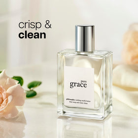 philosophy pure grace spray in hand demonstrating travel-friendly use benefit: convenient refresh