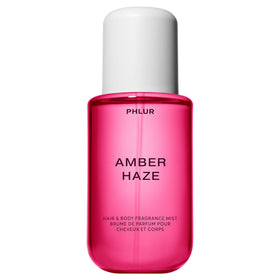 PHLUR Amber Haze bottle front view showing warm amber packaging and inviting scent