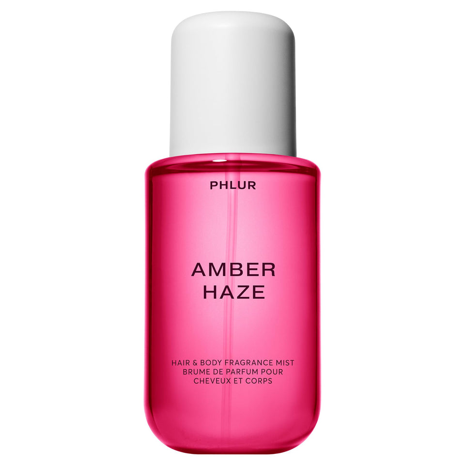 PHLUR Amber Haze bottle front view showing warm amber packaging and inviting scent