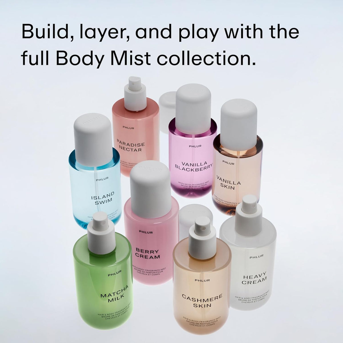 PHLUR mist sprayed through hair in sunlight showing fragrance lift and natural finish